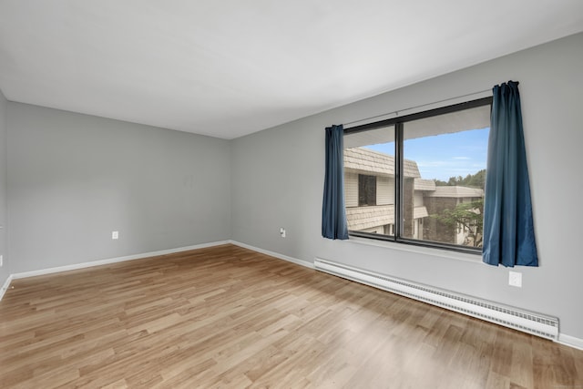16 Pine Ct Unit 16, Cromwell, CT 06416 - spare room featuring a baseboard radiator and light wood-type flooring
