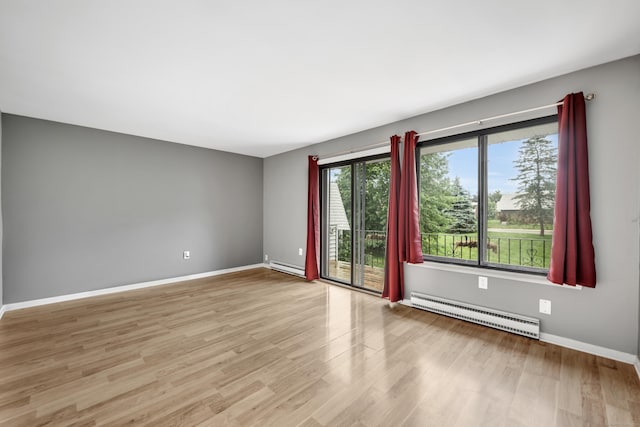 16 Pine Ct Unit 16, Cromwell, CT 06416 - empty room featuring a baseboard radiator and wood finished floors