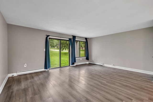 16 Pine Ct Unit 16, Cromwell, CT 06416 - empty room with a baseboard radiator and wood finished floors
