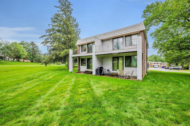 16 Pine Ct Unit 16, Cromwell, CT 06416 - rear view of property featuring a balcony and a yard