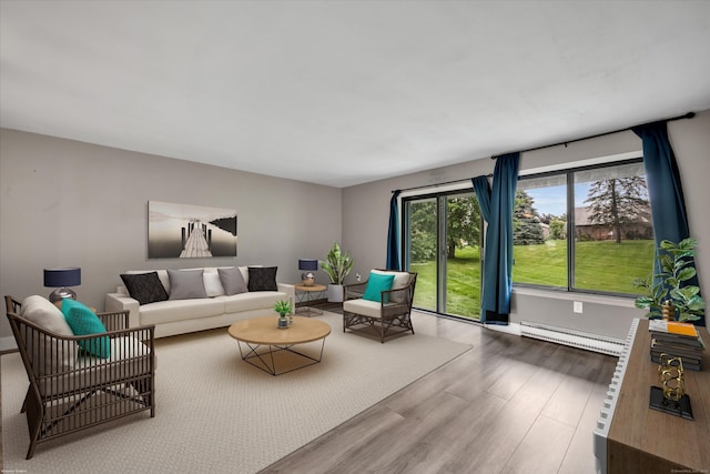 16 Pine Ct Unit 16, Cromwell, CT 06416 - living room featuring a baseboard heating unit and wood finished floors