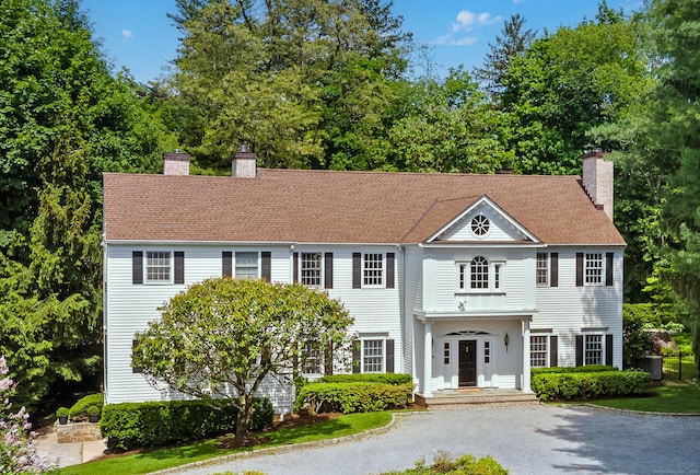 34 Edgewood Dr, Greenwich, CT 06831 - view of front of property with a chimney and asphalt driveway