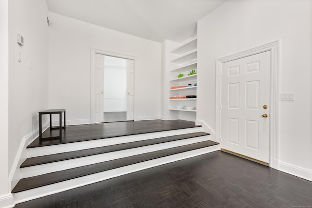 34 Edgewood Dr, Greenwich, CT 06831 - stairs featuring built in shelves and baseboards
