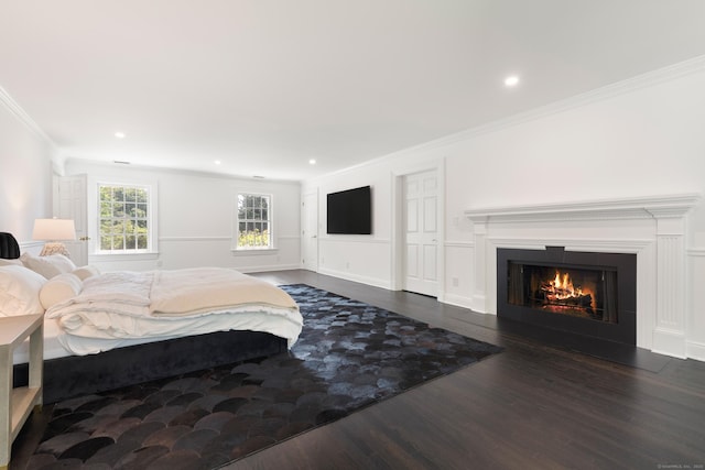 34 Edgewood Dr, Greenwich, CT 06831 - bedroom with wood finished floors, crown molding, a fireplace with flush hearth, and recessed lighting