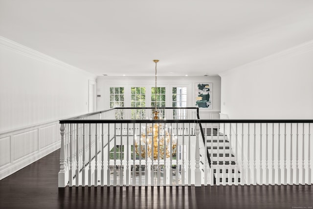 34 Edgewood Dr, Greenwich, CT 06831 - corridor featuring crown molding, a decorative wall, an upstairs landing, wood finished floors, and wainscoting