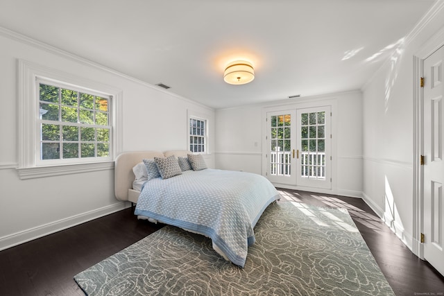 34 Edgewood Dr, Greenwich, CT 06831 - bedroom with french doors, multiple windows, access to outside, dark wood-style floors, and ornamental molding