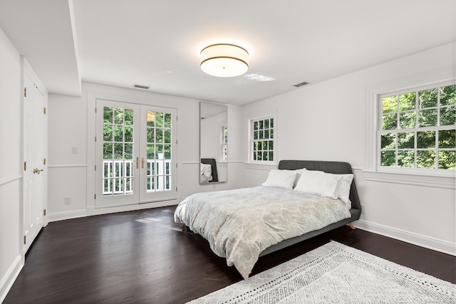 34 Edgewood Dr, Greenwich, CT 06831 - bedroom with dark wood-style flooring, french doors, access to outside, and multiple windows