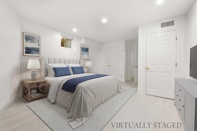 34 Edgewood Dr, Greenwich, CT 06831 - bedroom featuring light wood-style flooring, recessed lighting, and a closet