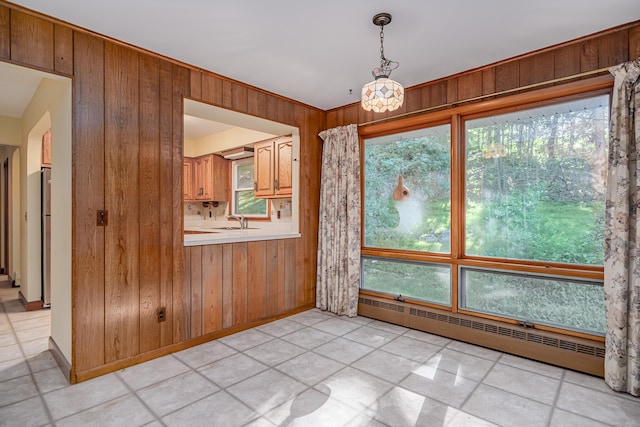 24 Warwick Rd, New Fairfield, CT 06812 - unfurnished dining area with wooden walls and baseboard heating