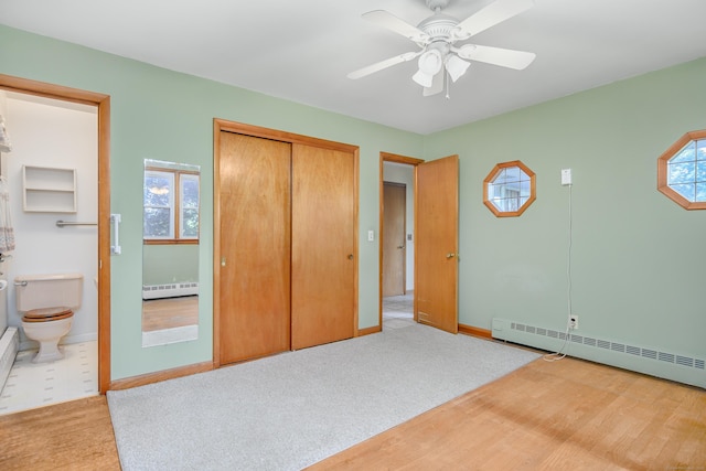 24 Warwick Rd, New Fairfield, CT 06812 - unfurnished bedroom featuring a baseboard radiator, a closet, and multiple windows