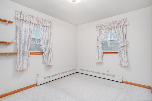 24 Warwick Rd, New Fairfield, CT 06812 - unfurnished room with healthy amount of natural light, carpet floors, a baseboard heating unit, and a baseboard radiator