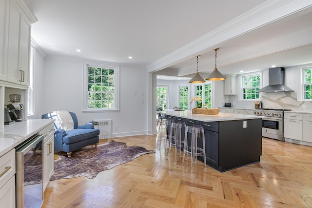 182 Bennetts Farm Rd, Ridgefield, CT 06877 - kitchen featuring wall chimney exhaust hood, high end range, wine cooler, radiator, and ornamental molding