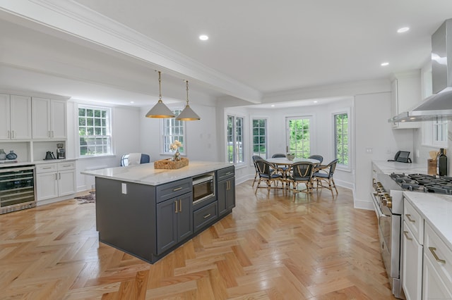 182 Bennetts Farm Rd, Ridgefield, CT 06877 - kitchen with appliances with stainless steel finishes, wall chimney exhaust hood, beverage cooler, white cabinets, and recessed lighting