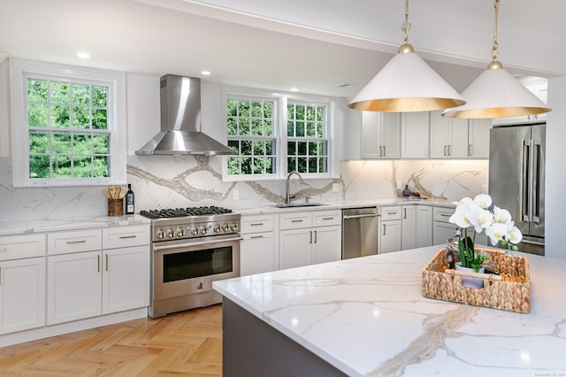 182 Bennetts Farm Rd, Ridgefield, CT 06877 - kitchen with high quality appliances, island exhaust hood, light stone counters, decorative light fixtures, and white cabinetry