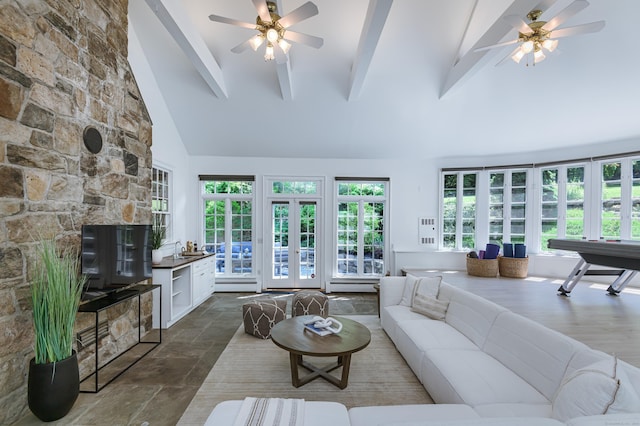 182 Bennetts Farm Rd, Ridgefield, CT 06877 - living room featuring ceiling fan, beamed ceiling, high vaulted ceiling, dark stone finish floors, and plenty of natural light