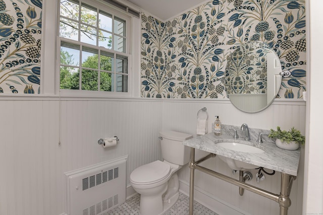 182 Bennetts Farm Rd, Ridgefield, CT 06877 - bathroom with radiator, a wainscoted wall, wallpapered walls, and crown molding
