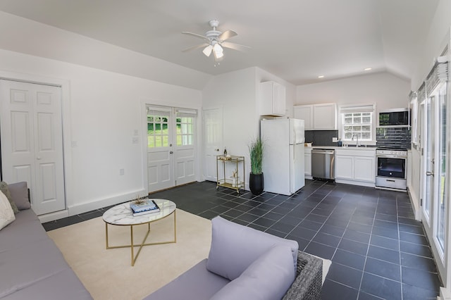 182 Bennetts Farm Rd, Ridgefield, CT 06877 - living room with lofted ceiling, dark tile patterned flooring, a ceiling fan, and recessed lighting