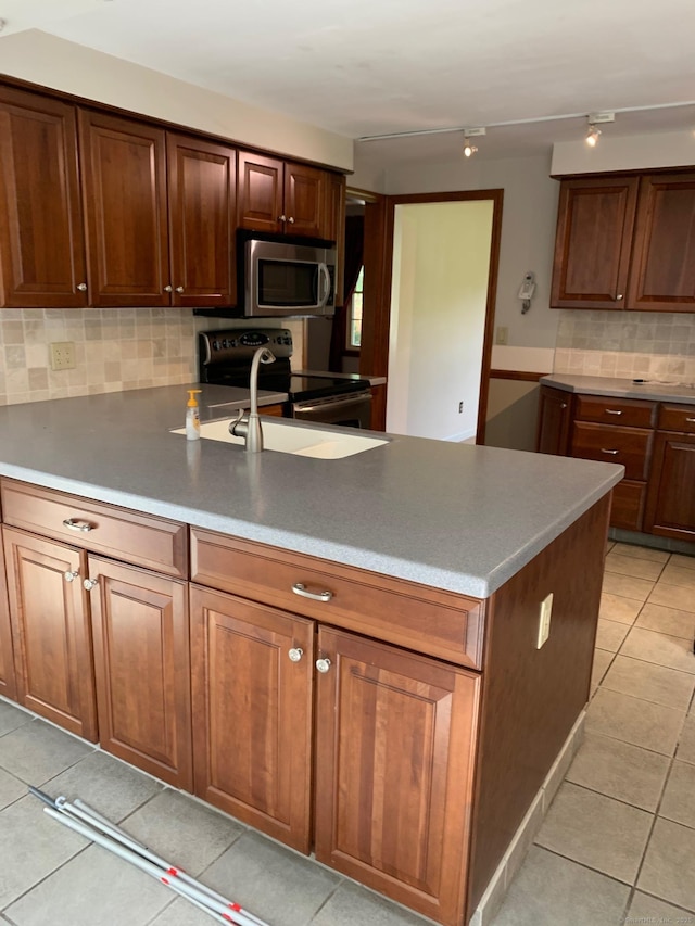 180 Round Hill Rd, Cheshire, CT 06410 - kitchen with appliances with stainless steel finishes, backsplash, a peninsula, and light tile patterned floors