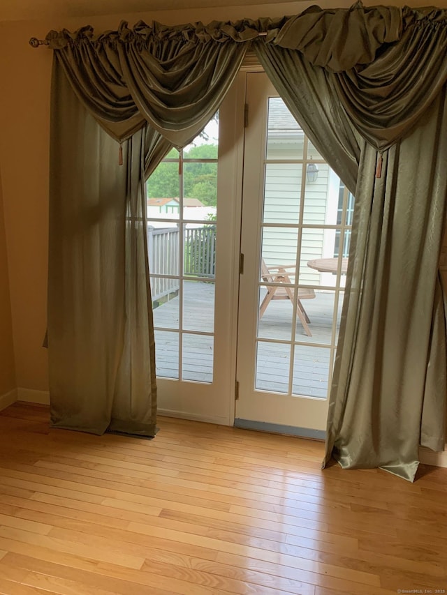 180 Round Hill Rd, Cheshire, CT 06410 - doorway to outside featuring light wood finished floors and baseboards