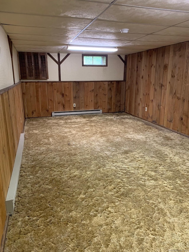 180 Round Hill Rd, Cheshire, CT 06410 - basement featuring wooden walls and a baseboard heating unit