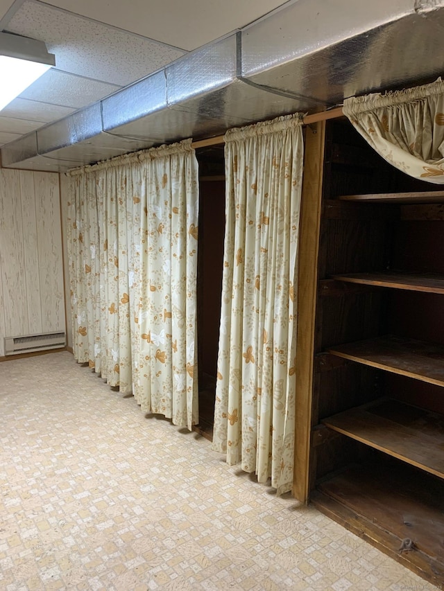 180 Round Hill Rd, Cheshire, CT 06410 - finished below grade area featuring a paneled ceiling and baseboard heating