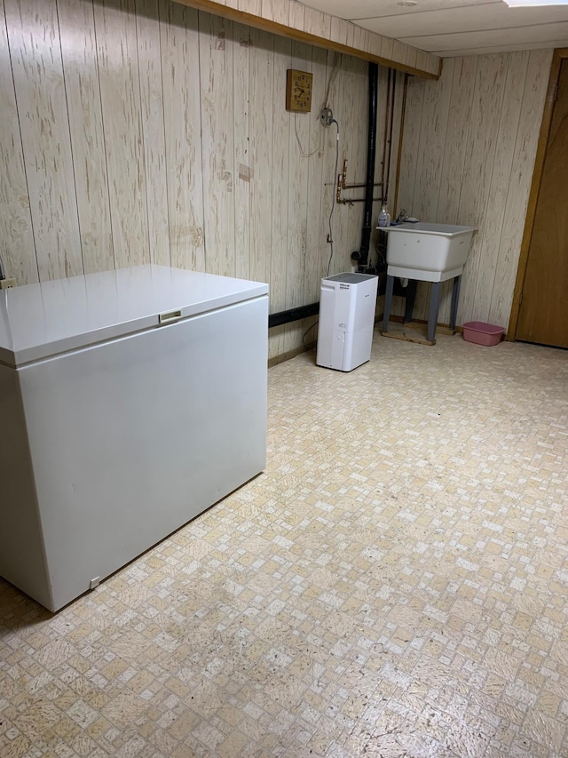 180 Round Hill Rd, Cheshire, CT 06410 - finished below grade area featuring wooden walls and white refrigerator