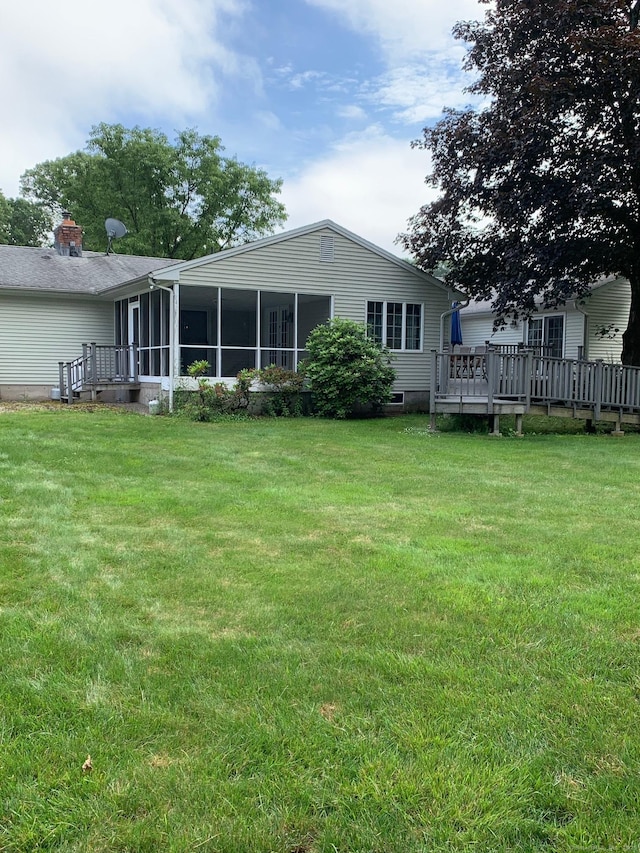 180 Round Hill Rd, Cheshire, CT 06410 - rear view of house with a sunroom, a lawn, and a wooden deck