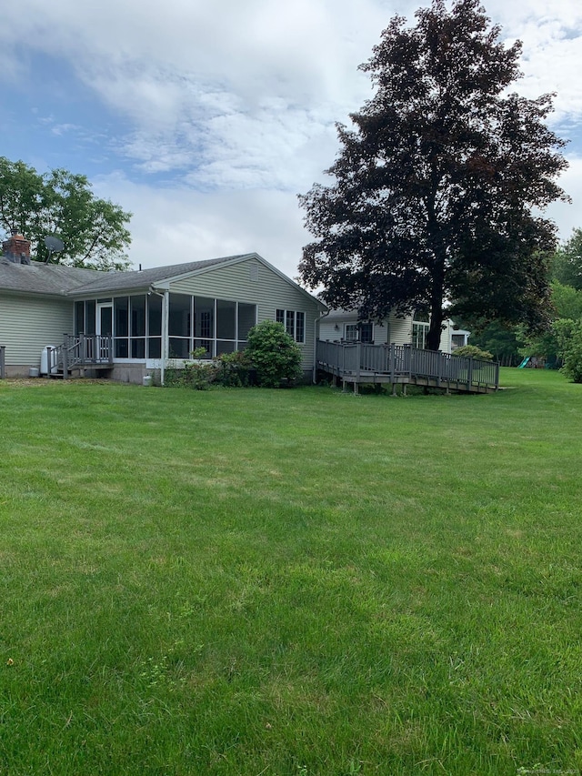 180 Round Hill Rd, Cheshire, CT 06410 - view of grassy yard with a sunroom and a wooden deck