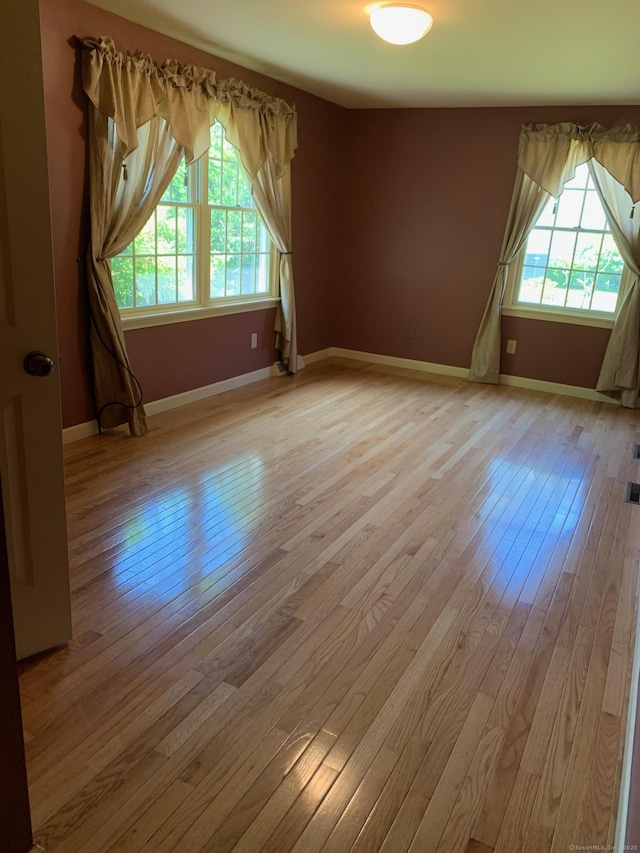 180 Round Hill Rd, Cheshire, CT 06410 - spare room with plenty of natural light and light wood finished floors