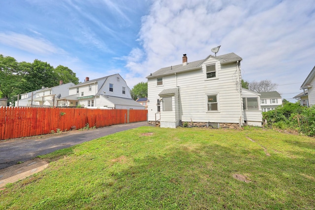 42 Marlboro St, Waterbury, CT 06705 - rear view of property with a chimney