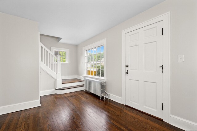 42 Marlboro St, Waterbury, CT 06705 - entryway featuring radiator heating unit, wood finished floors, and stairs