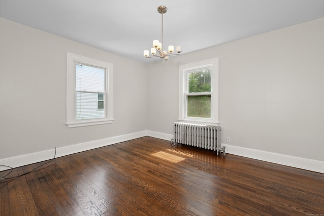 42 Marlboro St, Waterbury, CT 06705 - unfurnished room with radiator heating unit, a chandelier, and wood finished floors