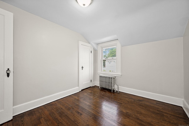 42 Marlboro St, Waterbury, CT 06705 - additional living space featuring radiator heating unit, vaulted ceiling, and wood finished floors