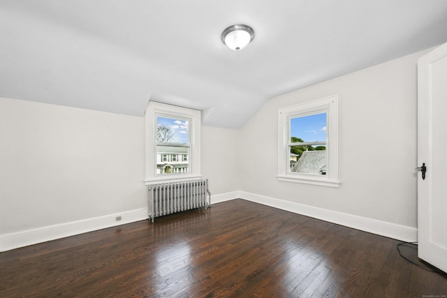 42 Marlboro St, Waterbury, CT 06705 - bonus room featuring radiator heating unit, healthy amount of natural light, vaulted ceiling, and dark wood finished floors