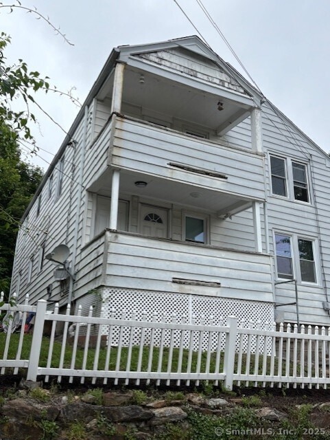 31 Happy St, Norwich, CT 06360 - view of front facade with a balcony