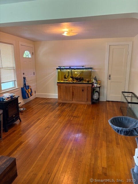 31 Happy St, Norwich, CT 06360 - living room featuring hardwood / wood-style floors and baseboards