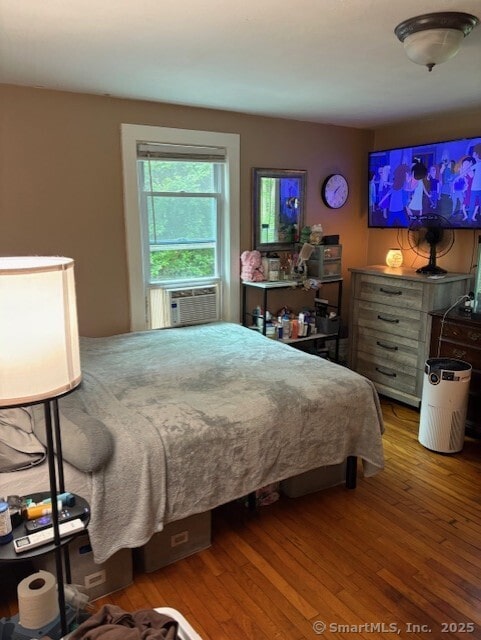 31 Happy St, Norwich, CT 06360 - bedroom featuring cooling unit and wood finished floors
