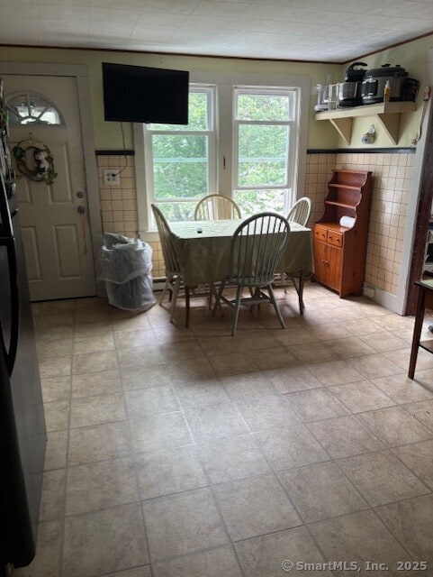 31 Happy St, Norwich, CT 06360 - dining room with tile walls and a wainscoted wall