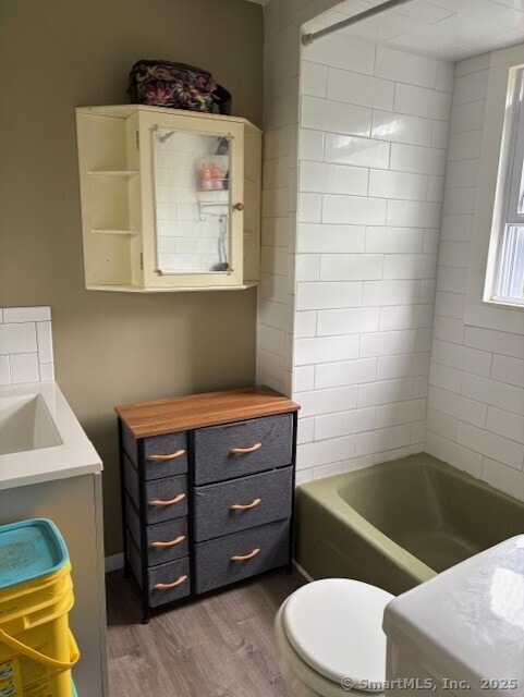 31 Happy St, Norwich, CT 06360 - full bathroom featuring wood finished floors, vanity, and  shower combination