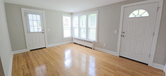 20 Old Stafford Rd, Tolland, CT 06084 - foyer entrance featuring radiator, healthy amount of natural light, and light wood-style floors