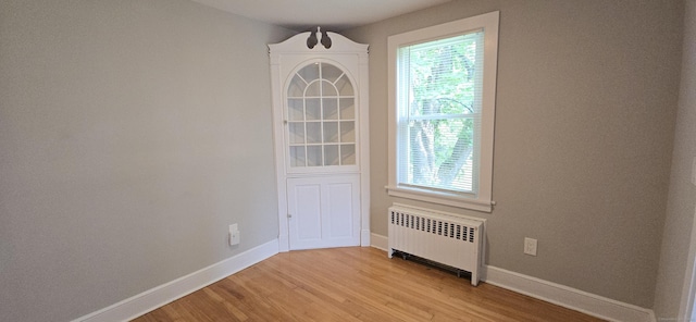 20 Old Stafford Rd, Tolland, CT 06084 - spare room featuring radiator and light wood-style floors