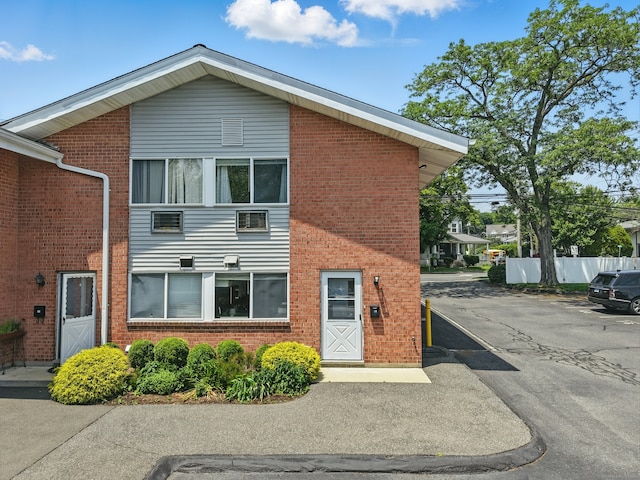 208 Flax Hill Rd Apt 10, Norwalk, CT 06854 - view of front of home with brick siding and uncovered parking