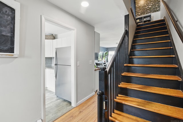 208 Flax Hill Rd Apt 10, Norwalk, CT 06854 - stairs featuring wood finished floors and baseboards