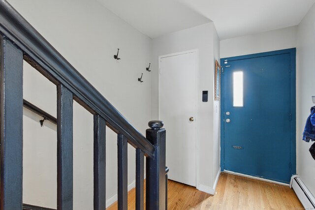 208 Flax Hill Rd Apt 10, Norwalk, CT 06854 - entryway with a baseboard radiator and light wood-style flooring