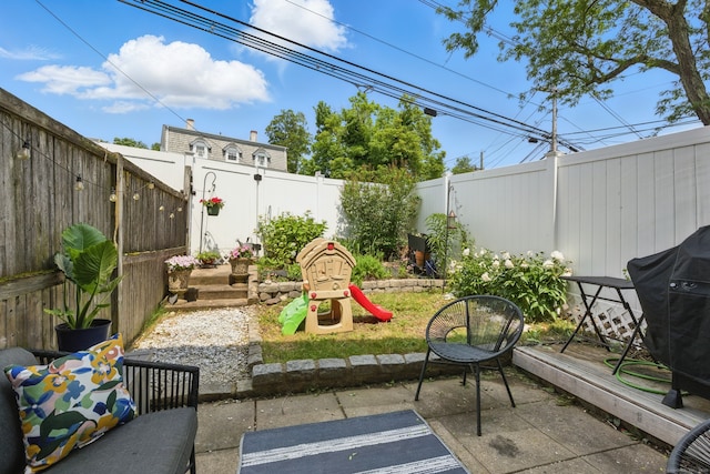 208 Flax Hill Rd Apt 10, Norwalk, CT 06854 - fenced backyard featuring grilling area and a patio