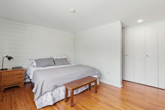 208 Flax Hill Rd Apt 10, Norwalk, CT 06854 - bedroom with light wood-style floors, a closet, and a baseboard heating unit