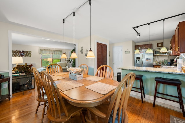 135 Liberty St Unit 135, Clinton, CT 06413 - dining area featuring rail lighting and light wood-type flooring