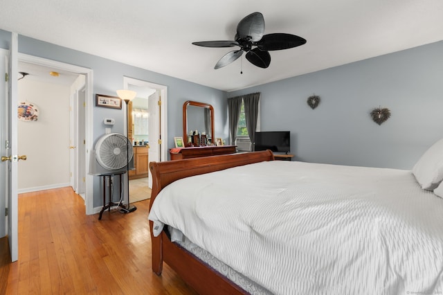 135 Liberty St Unit 135, Clinton, CT 06413 - bedroom featuring light wood finished floors, ceiling fan, and ensuite bathroom