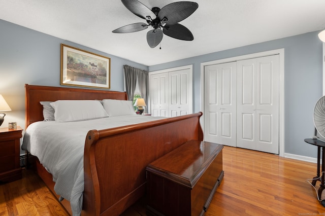 135 Liberty St Unit 135, Clinton, CT 06413 - bedroom with multiple closets, light wood finished floors, and a ceiling fan