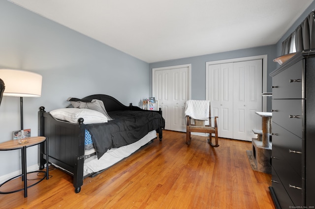 135 Liberty St Unit 135, Clinton, CT 06413 - bedroom featuring two closets and light wood finished floors